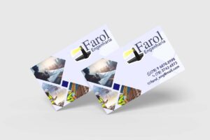 Cartões Farol Engenharia com logo e imagens de obras